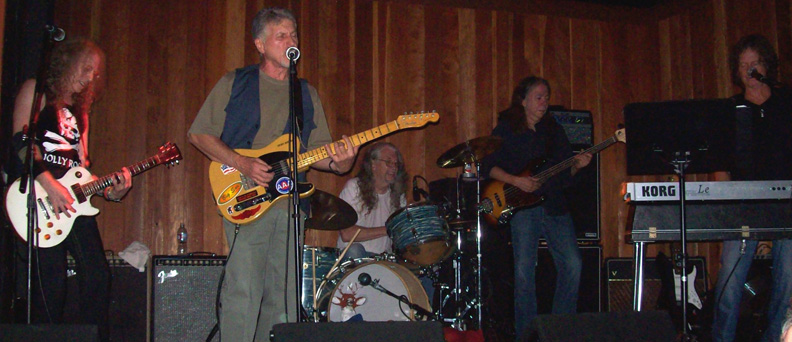 Waddy Wachtel, Johnny Rivers, Phil Jones, Rick Rosas, Brett Tuggle