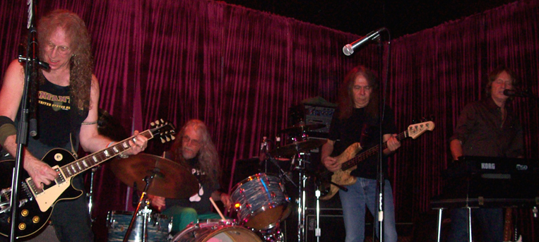 Waddy Wachtel, Phil Jones, Rick Rosas, Brett Tuggle